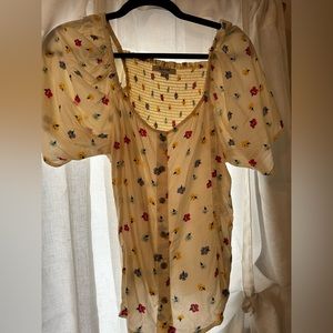 Madewell blouse with flutter sleeves and flower detailing